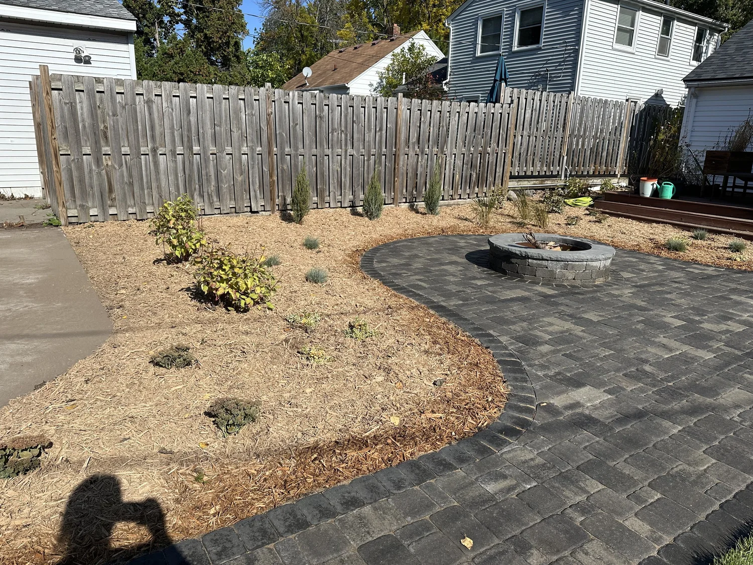 Completed RCP Colonial patio with fire pit and planting beds — Como Park Saint Paul — Heritage Outdoors 2025