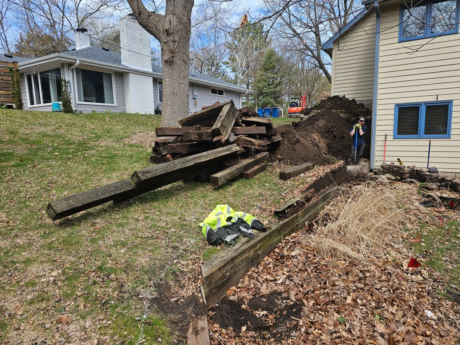 Pile of rotting timber wall removed from Burnsville MN property — Heritage Outdoors