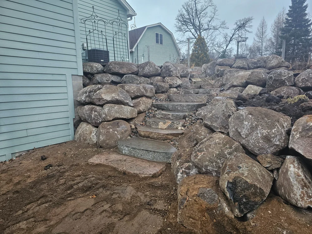 Cut boulder steps with tiered fieldstone wall — Wyoming MN — Heritage Outdoors 2024