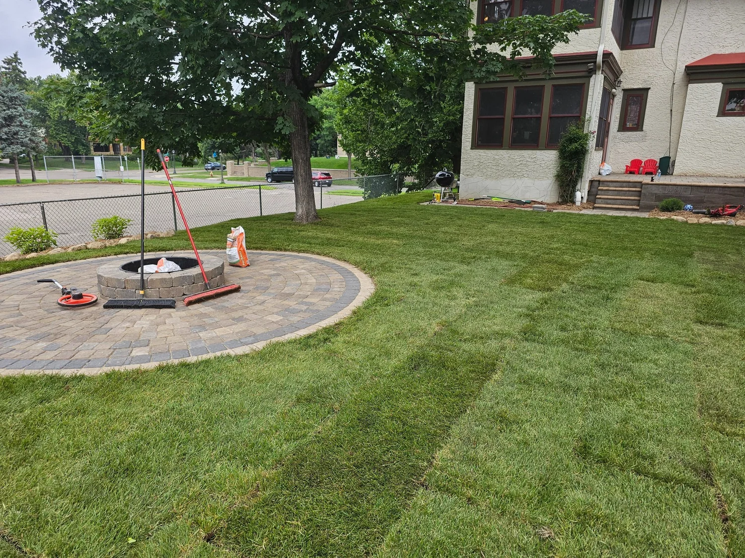 Completed firepit patio with fresh sod — Summit Hill Saint Paul MN — Heritage Outdoors 2025