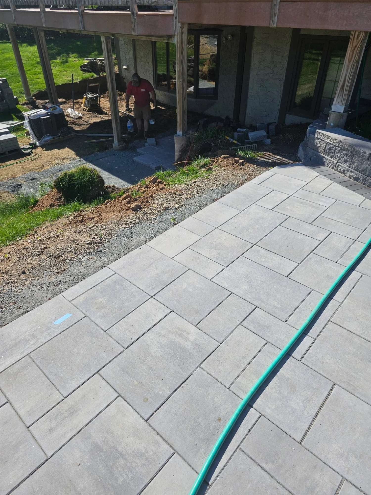 Unilock Beacon Hill pool deck walkway install in progress — Lake Elmo MN — Heritage Outdoors crew