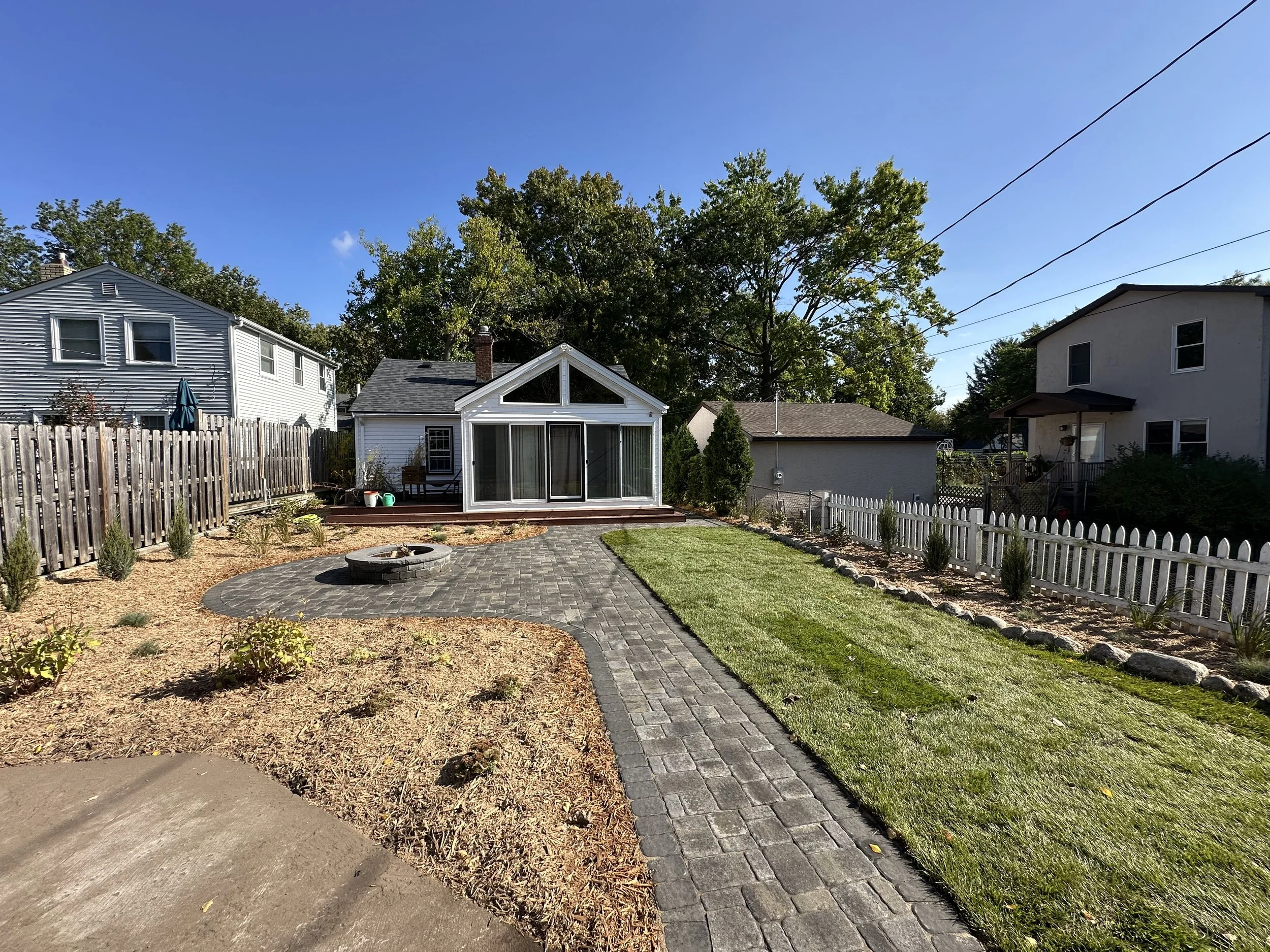 Completed RCP Colonial paver walkway and patio with fire pit and sod lawn — Como Park, Saint Paul MN — Heritage Outdoors 2025