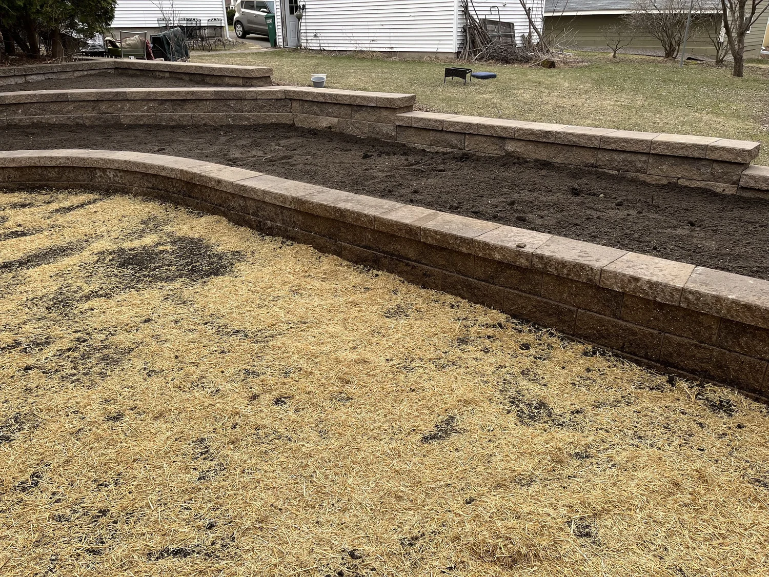 Versa-Lok tan curved planter boxes with garden space — Stillwater MN — Heritage Outdoors