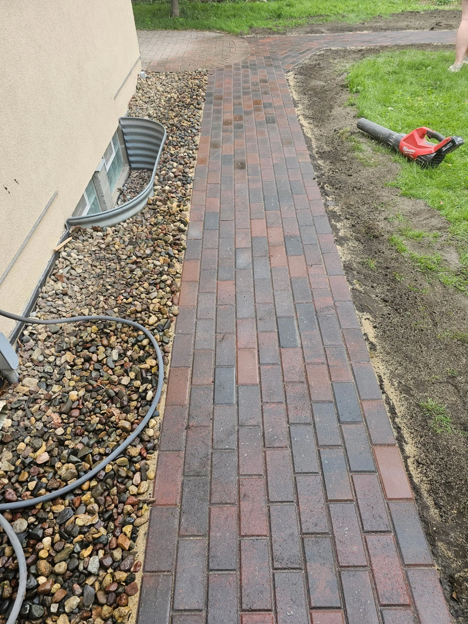 Willow Creek Brickstone RoseCreek walkway being installed alongside house — Mac-Groveland Saint Paul MN — Heritage Outdoors 2025