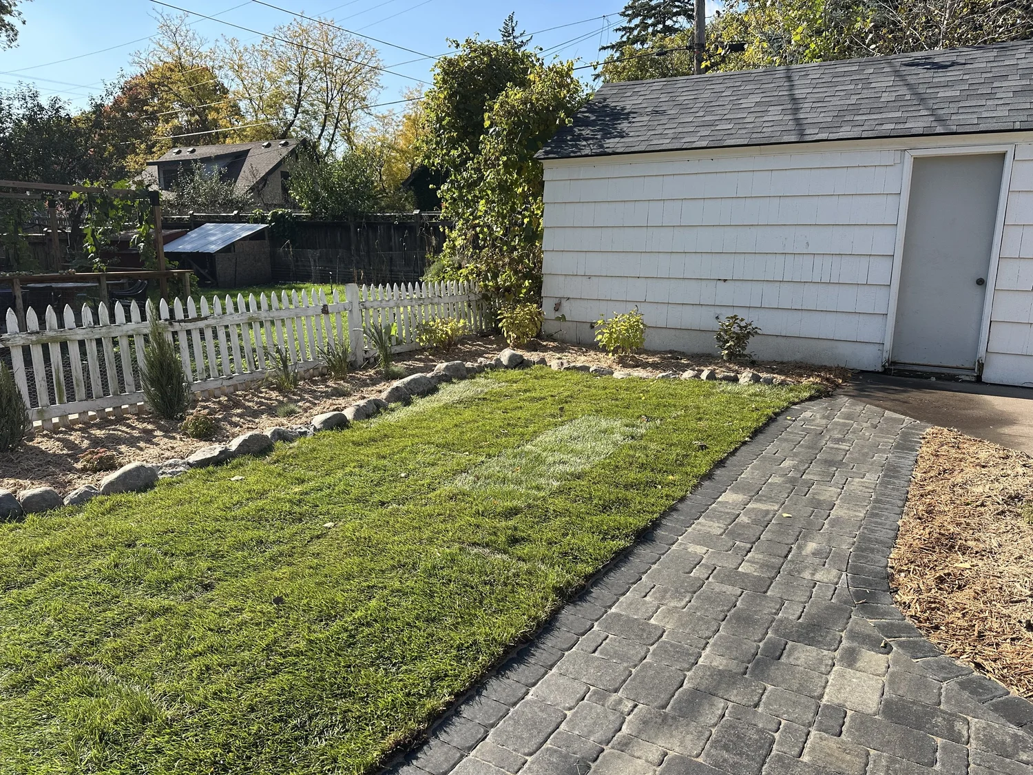 Completed paver walkway with sod and garden bed — Como Park Saint Paul — Heritage Outdoors 2025