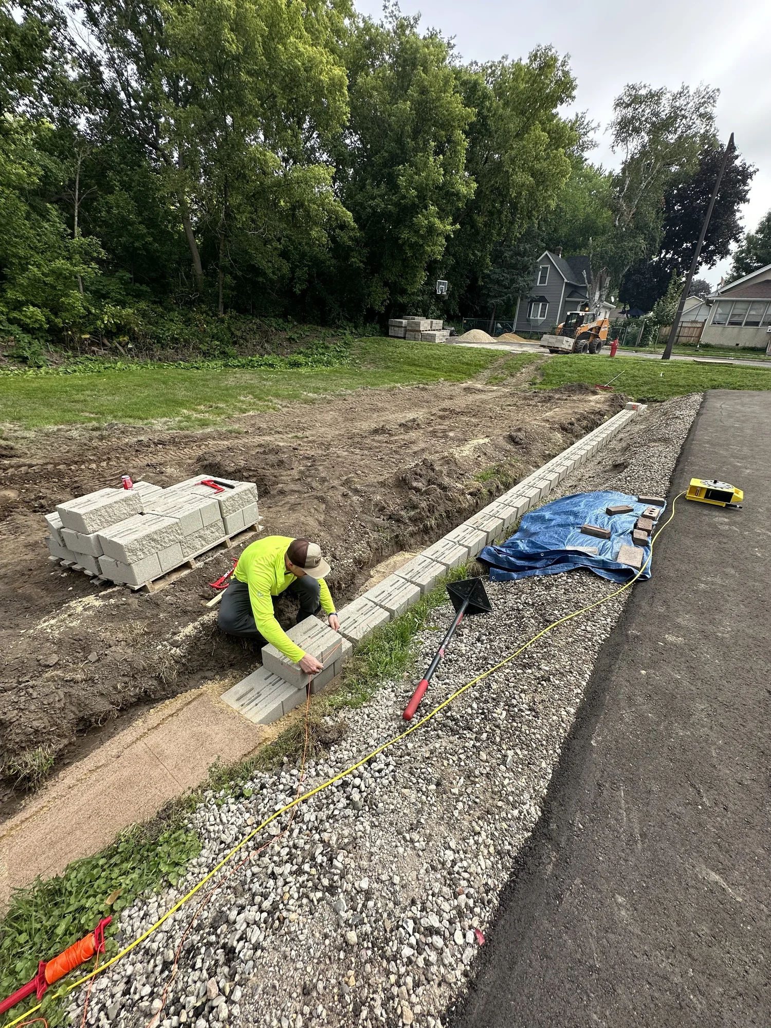 Versa-Lok Standard block retaining wall being installed along driveway — Como Park Saint Paul MN — Heritage Outdoors