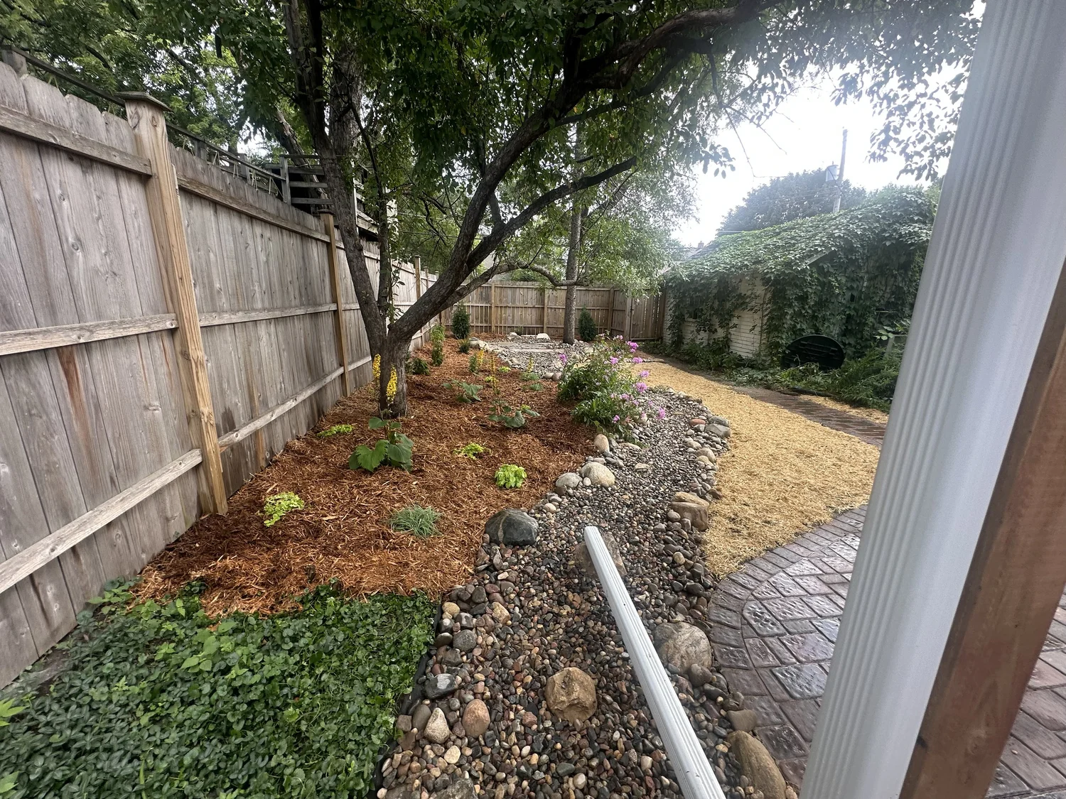 Completed Willow Creek RoseCreek patio with dry creek bed — Hamline-Midway Saint Paul MN — Heritage Outdoors 2025