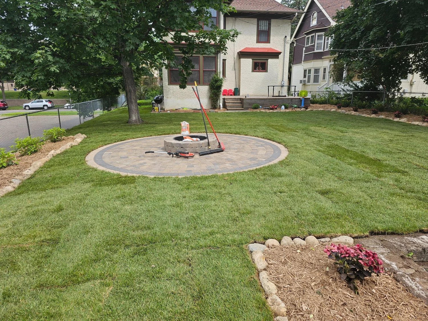 Completed backyard transformation firepit sod and gardens — Summit Hill Saint Paul MN — Heritage Outdoors 2025