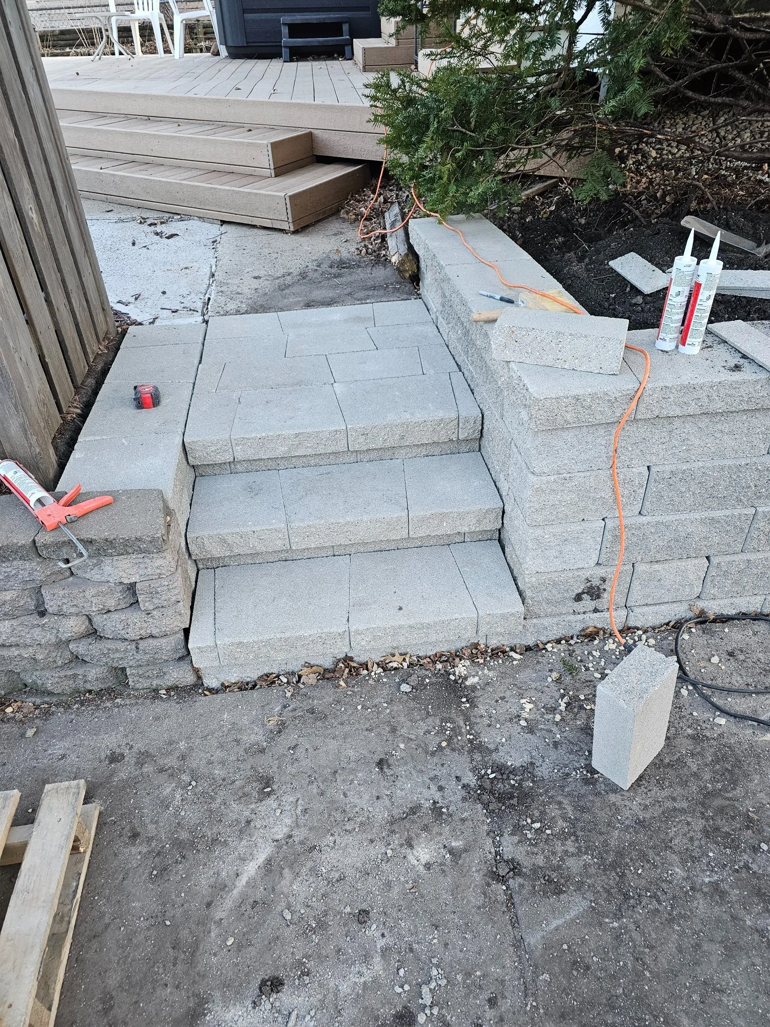 Versa-Lok retaining wall and steps during installation — Longfellow Minneapolis MN — Heritage Outdoors February 2024