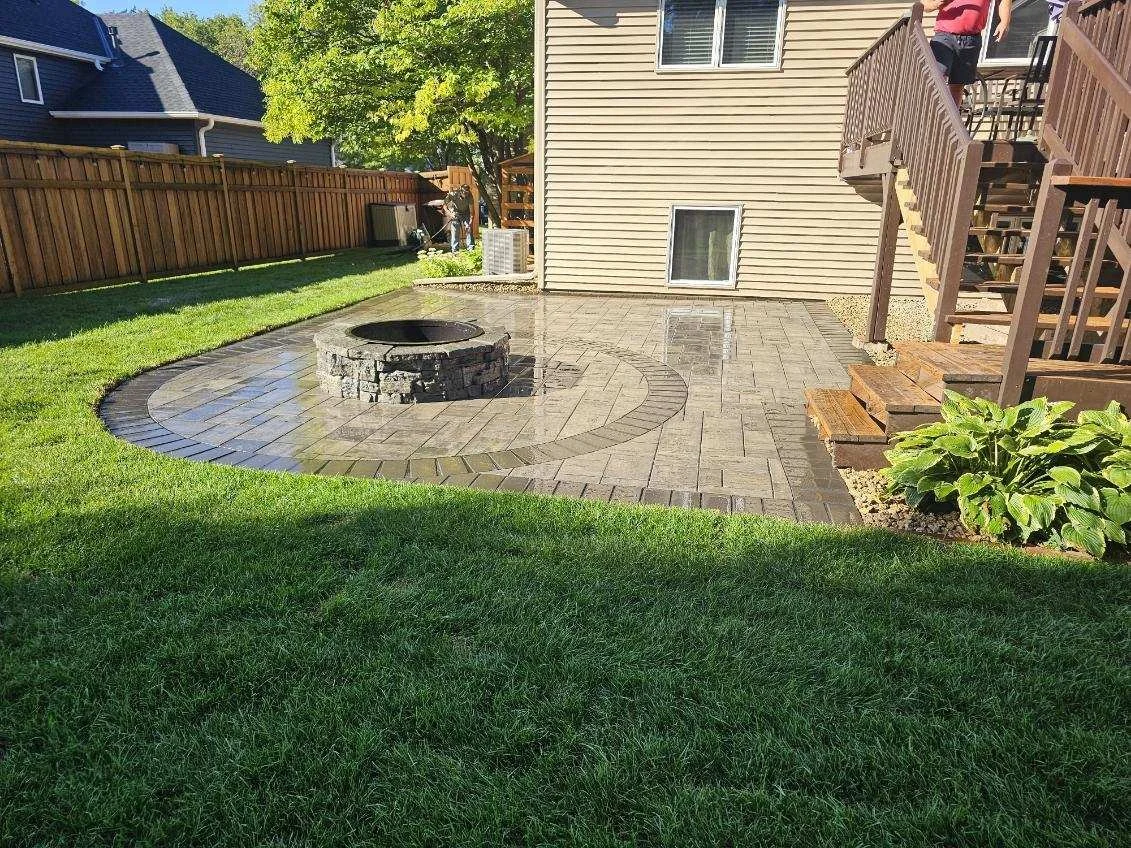 Completed RCP Reno paver patio with Rosetta Belvedere fire pit and circle accent border — Woodbury MN — Heritage Outdoors 2024