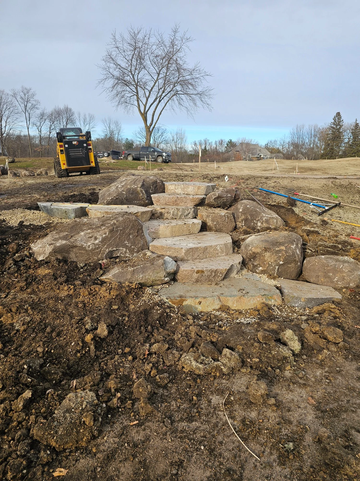 Cut granite boulder steps with fieldstone outcroppings — Wayzata Country Club golf course renovation — Heritage Outdoors