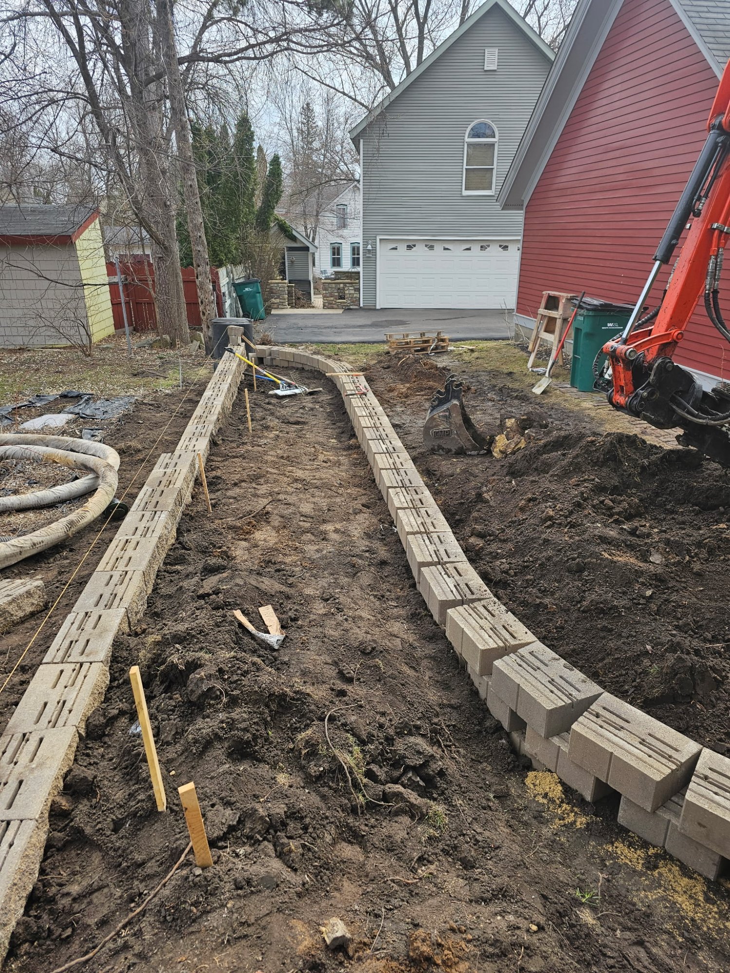 Both curved Versa-Lok planter box walls taking shape — Stillwater MN — Heritage Outdoors