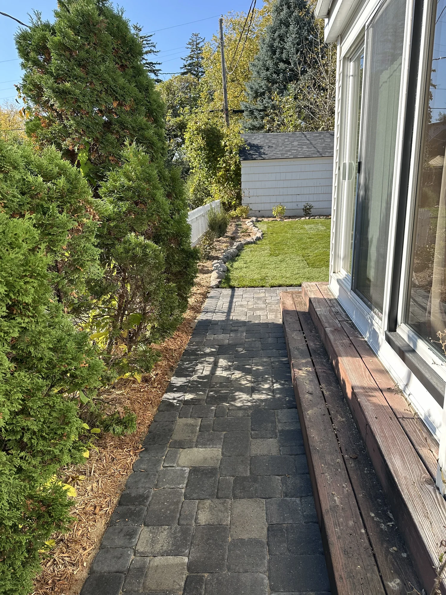 Completed paver walkway along side of house to sunroom — Como Park Saint Paul — Heritage Outdoors 2025