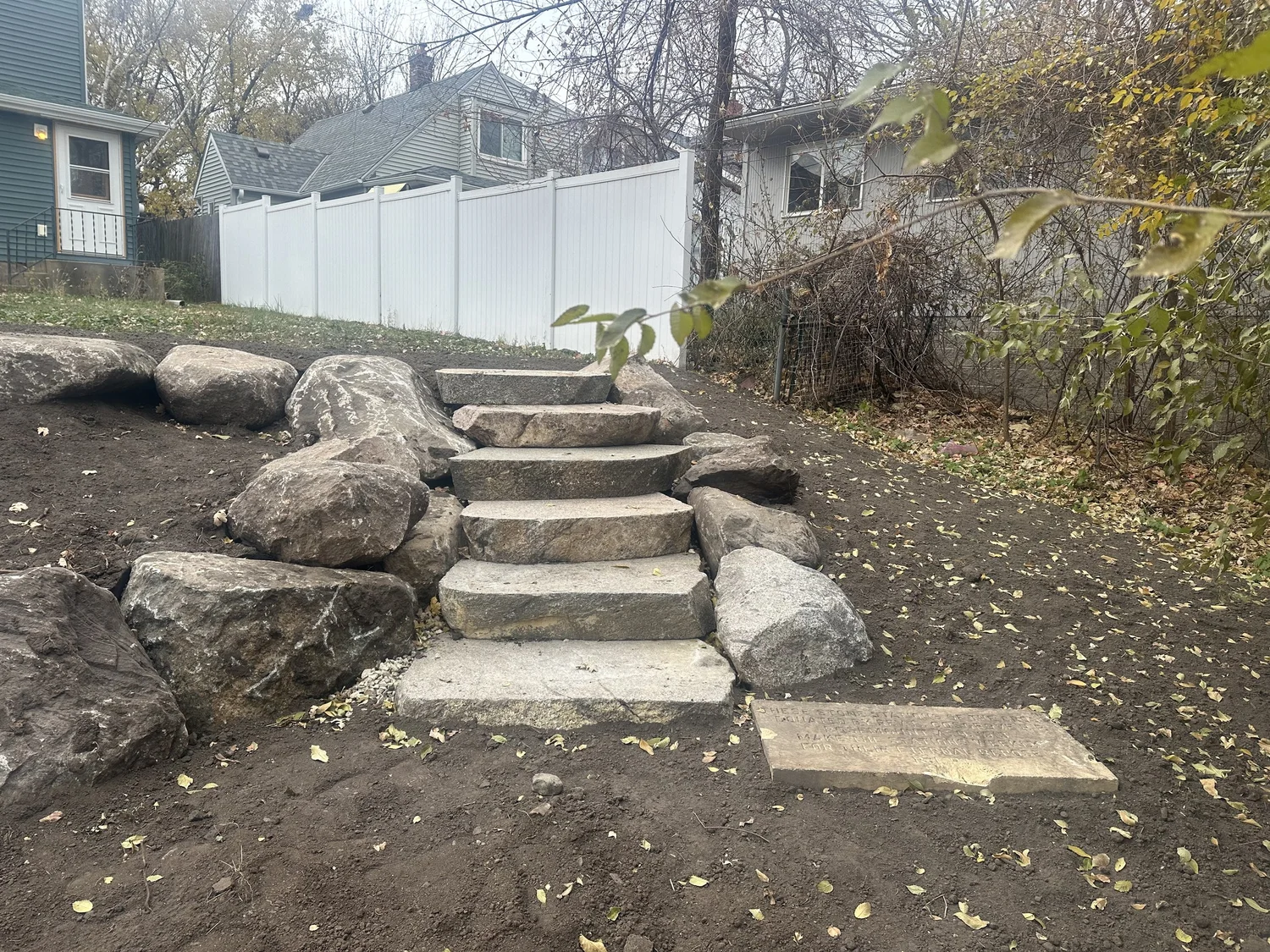 Boulder steps close-up with Station of the Cross stone at base — Saint Anthony Park, Saint Paul — Heritage Outdoors