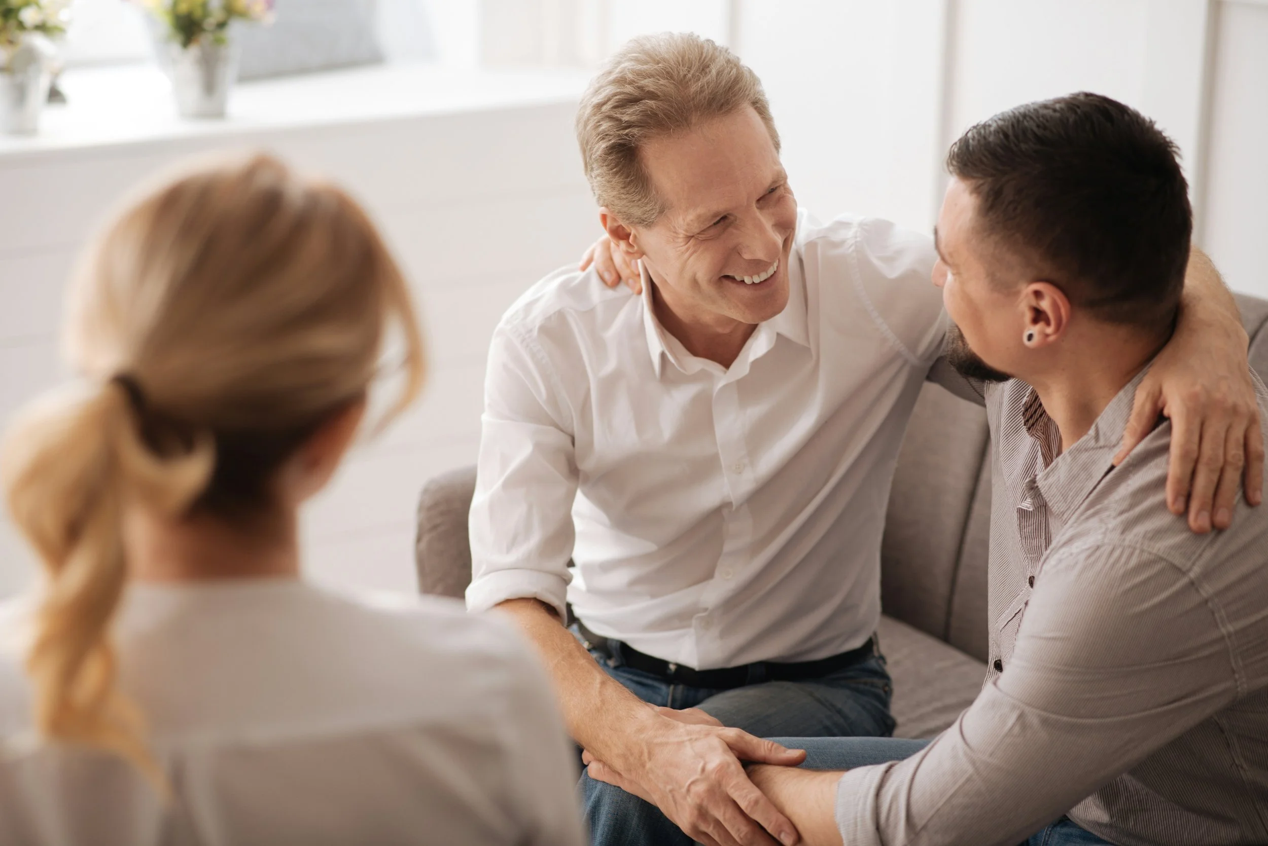 A therapist supporting a couple in session, demonstrating trauma-informed couples therapy that helps partners heal together through guided communication and emotional repair.