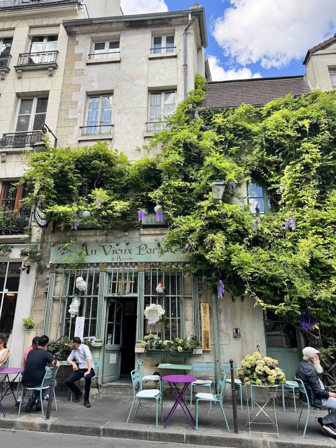 Charming Parisian Café with Ivy-Covered Facade