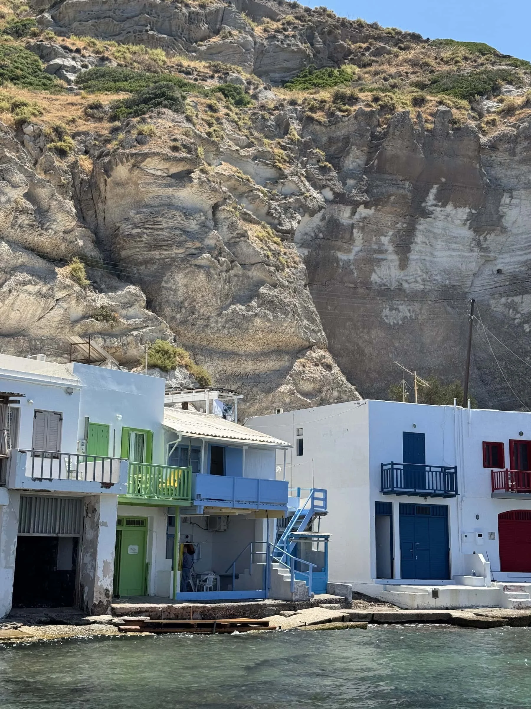 Colorful Boat Houses in Klima Beneath Milos Cliffs