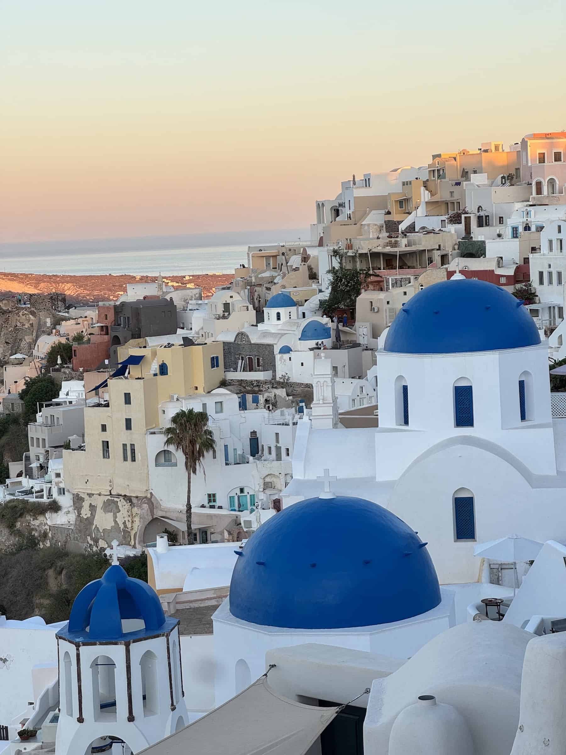 Blue-Domed Churches Overlooking the Caldera in Oia, Santorini Greece