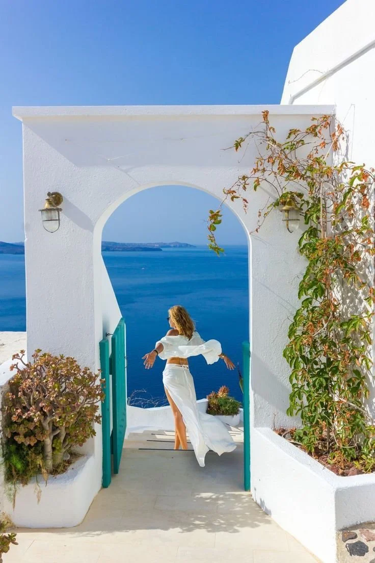 Billowing White Two-Piece by the Caldera’s Edge in Santorini