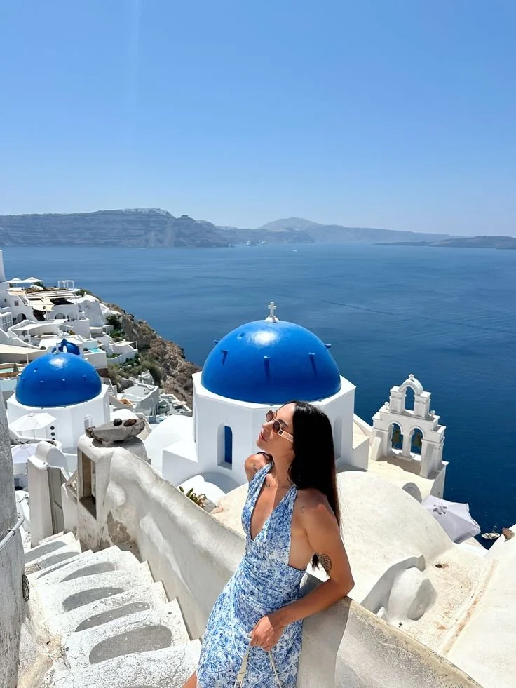Patterned Halter Dress Against Santorini’s Cliffside Views