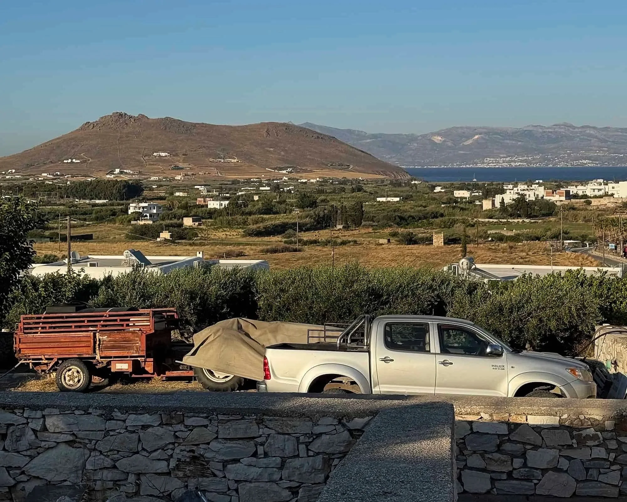 View of the rural hills and distant coastline from Prodromos village in Paros, Greece