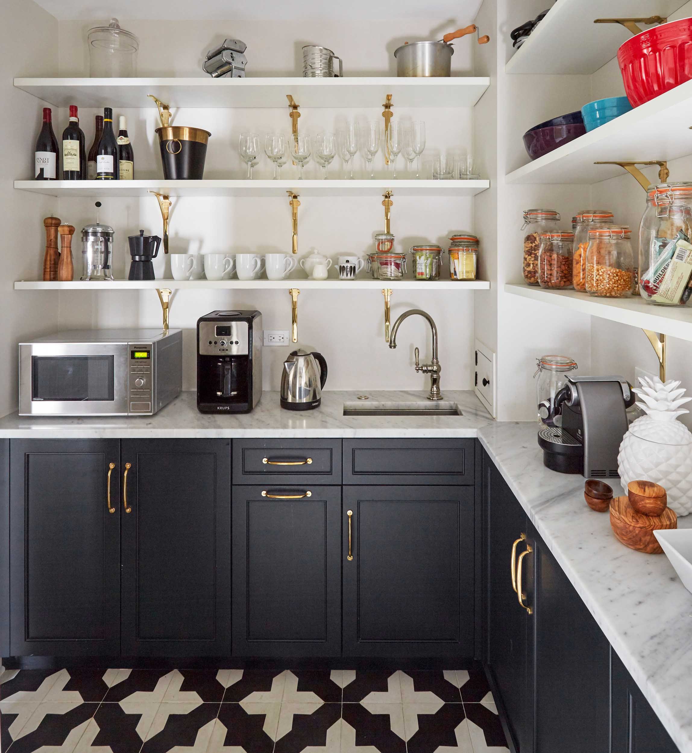 Pantry with appliances and organized goods and glassware