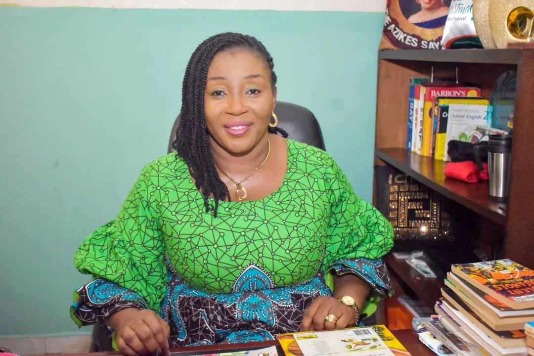 Dr. Mrs. Nkoyo Felicia Agbugui at her office desk in Fels Ideal Academy.