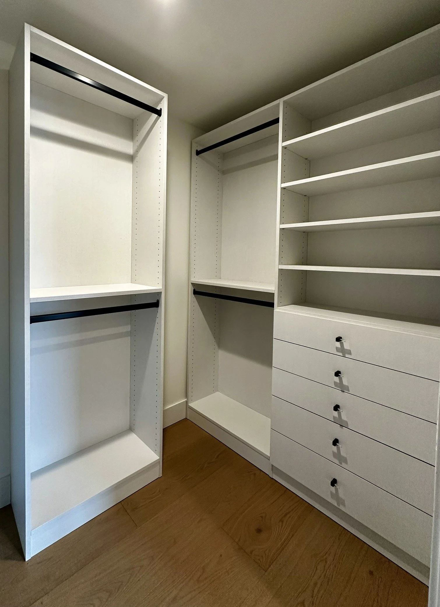 White linen guest closet, acrylic and black knobs