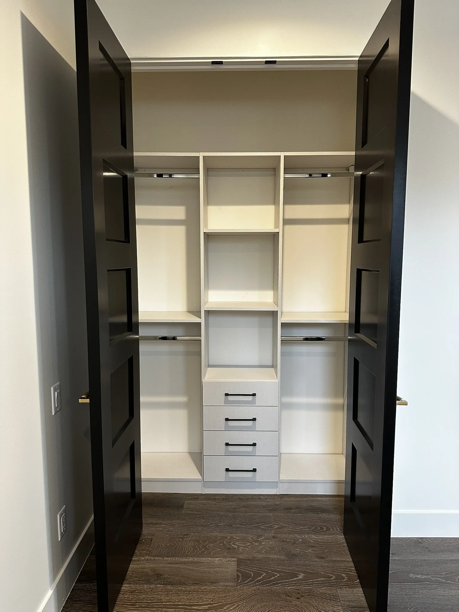 Full view, behind door reach in closet, white linen