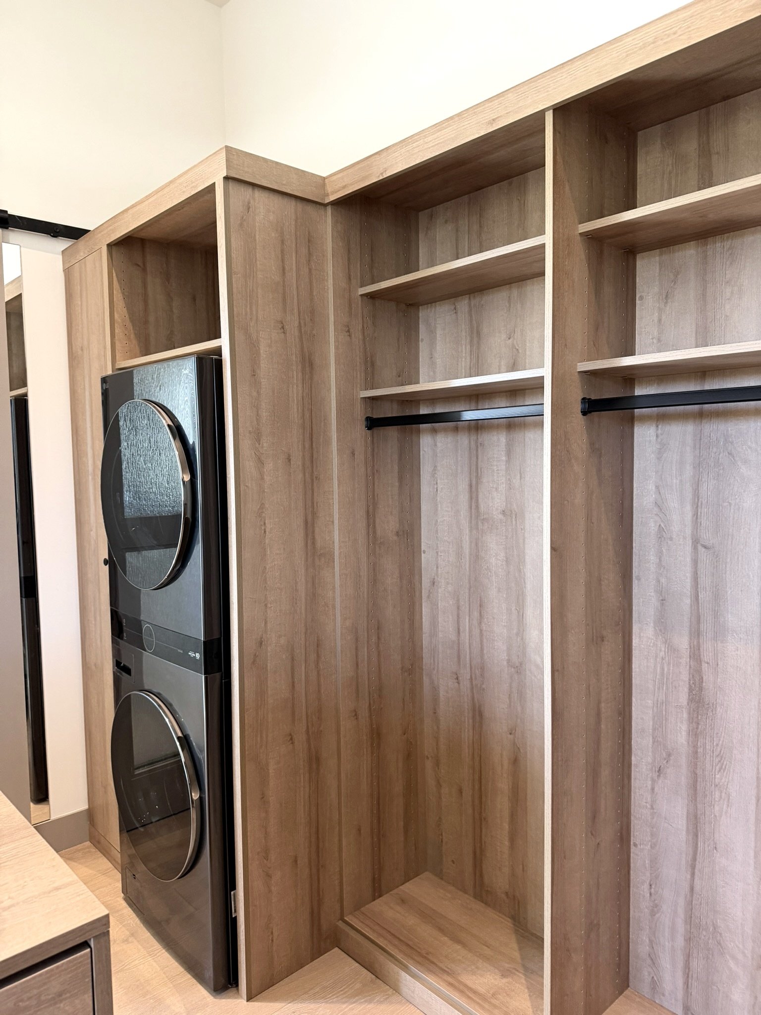 Master closet, built in laundry stack, long hangs with storage above