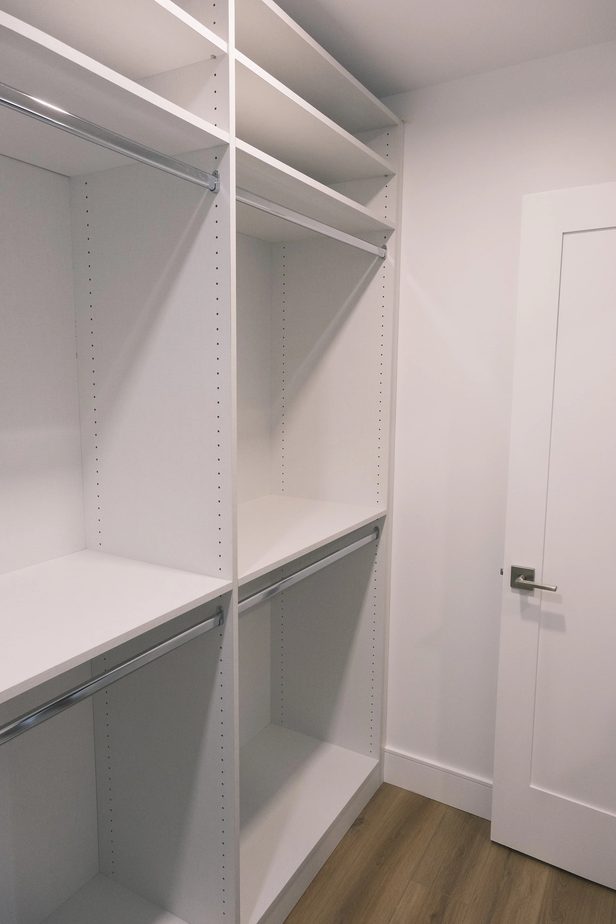 Guest walk in, chrome hardware, double hangs, storage above