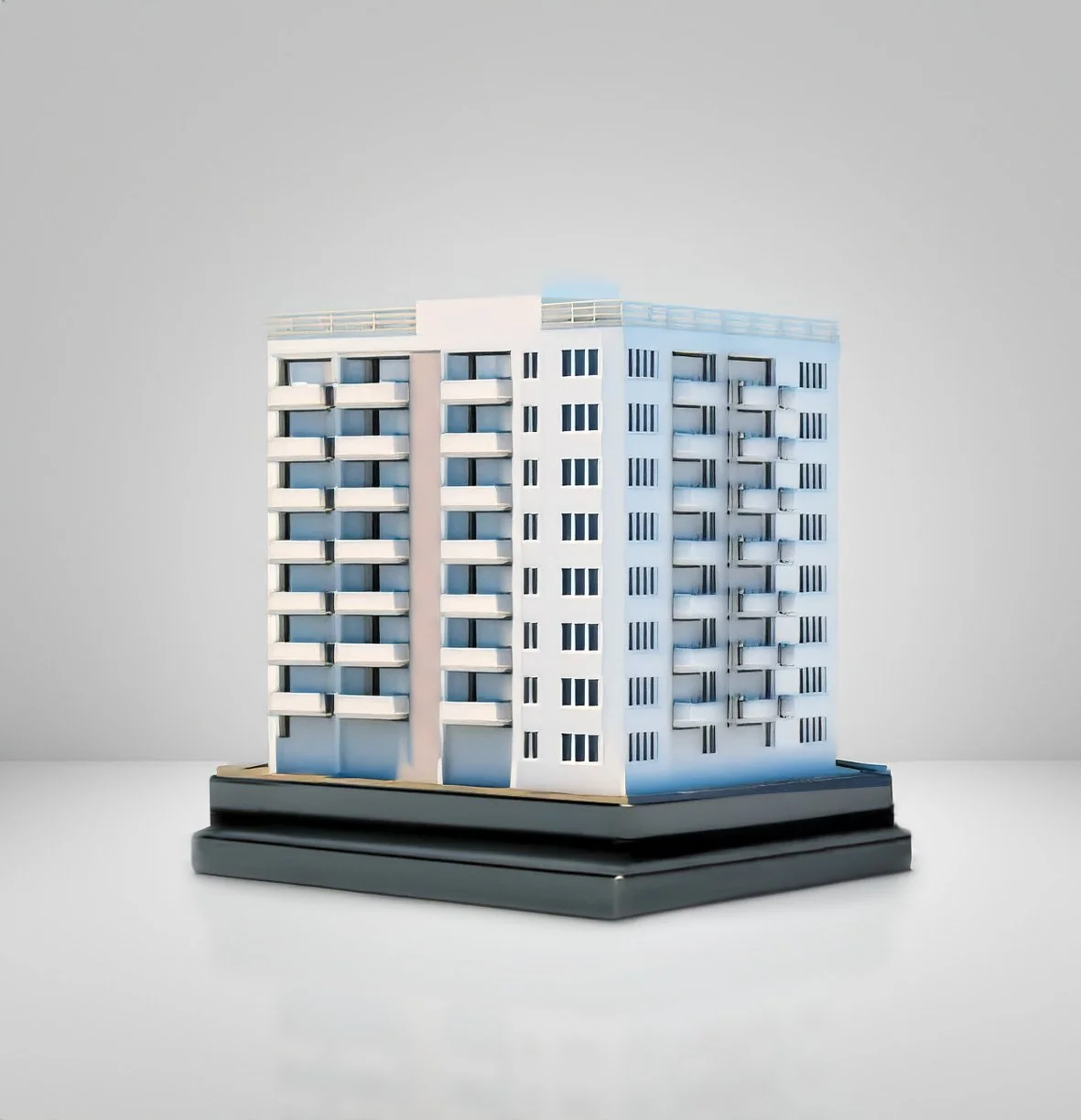 Detailed resin model of an apartment building representing a multifamily commercial real estate transaction