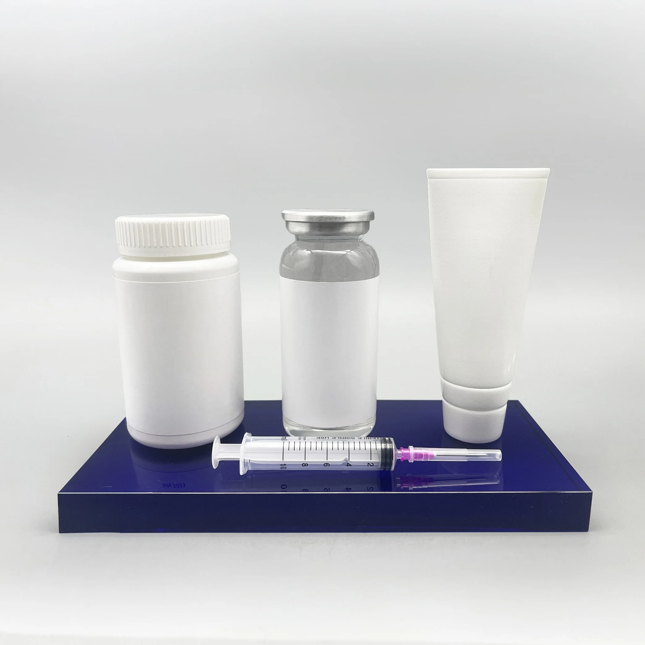 Replica pharmaceutical bottles syringe and tube recreated as custom deal toy award.
