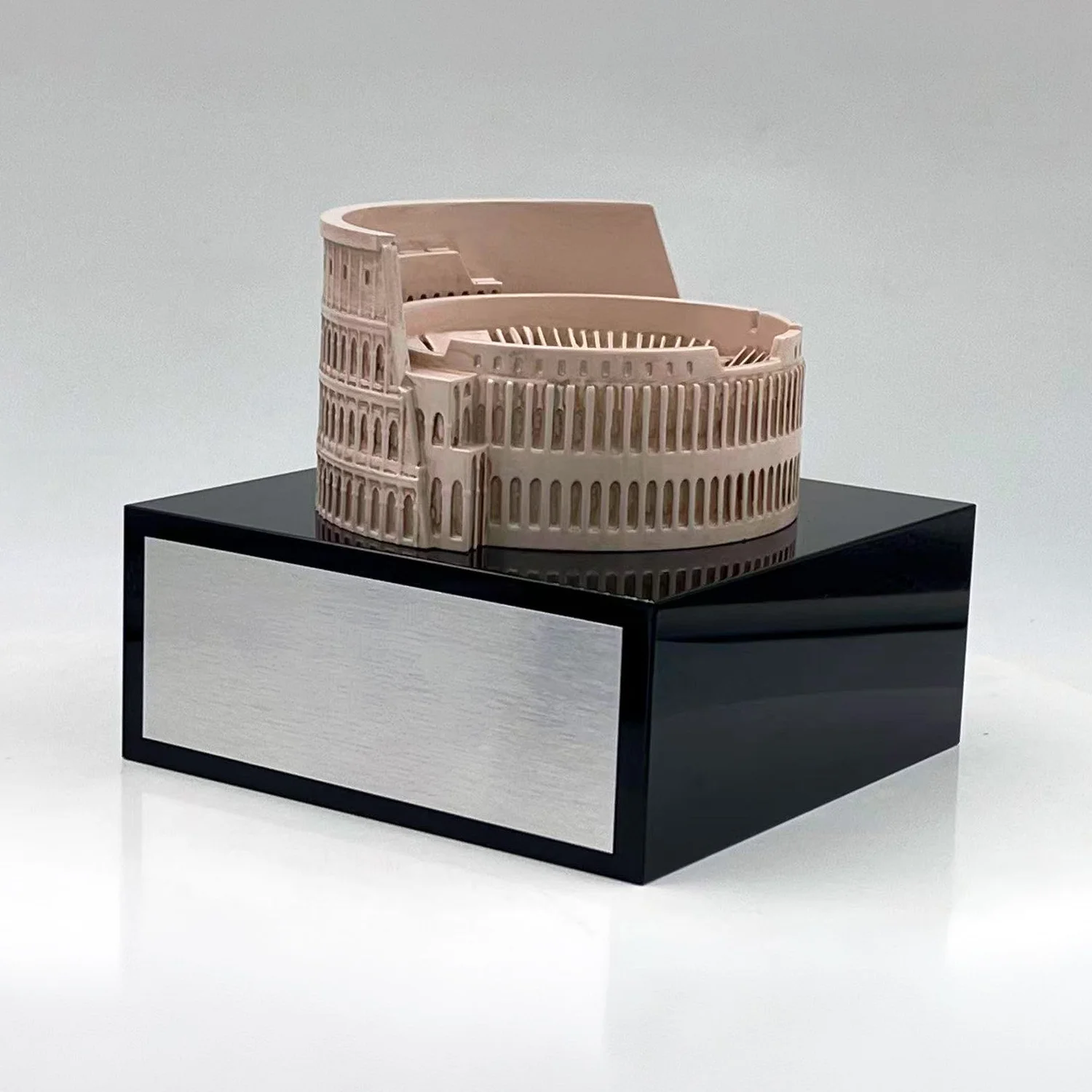 Detailed Colosseum model on a black base with a silver-colored plaque.