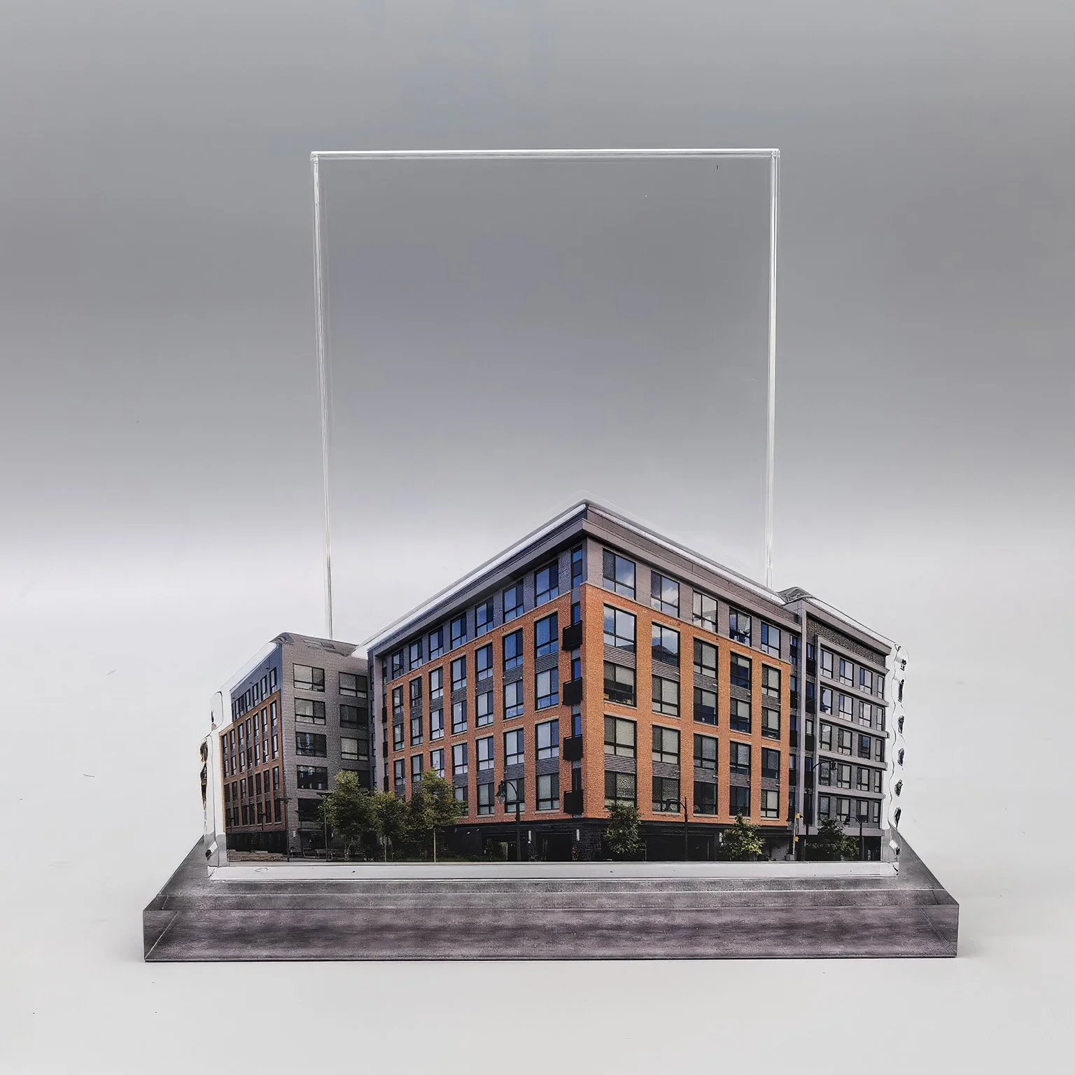 Custom deal toy celebrating a multifamily development with full-color building imagery and clear acrylic construction.