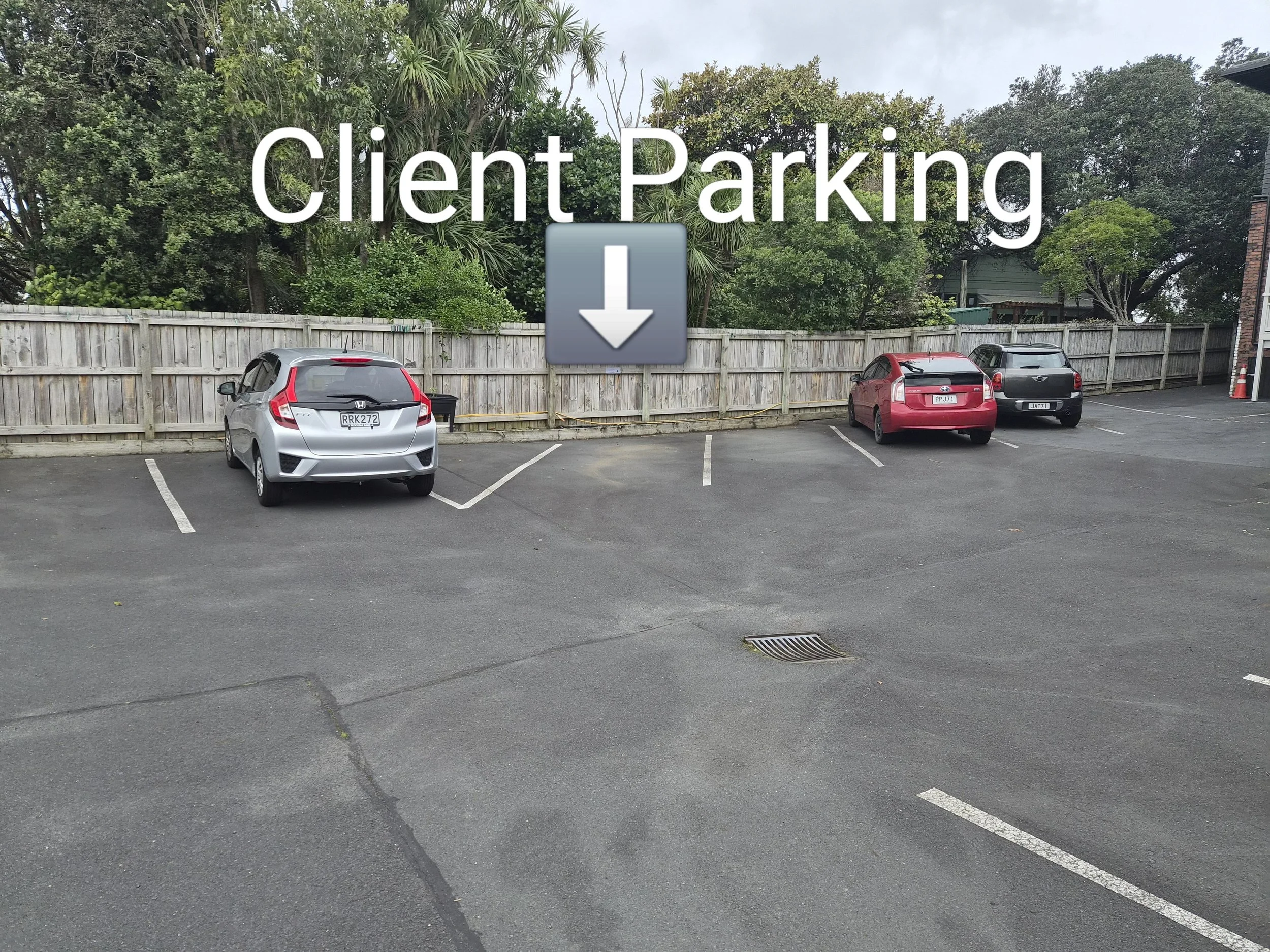 Client parking is the first angled space on the far side of the driveway, marked by #9.