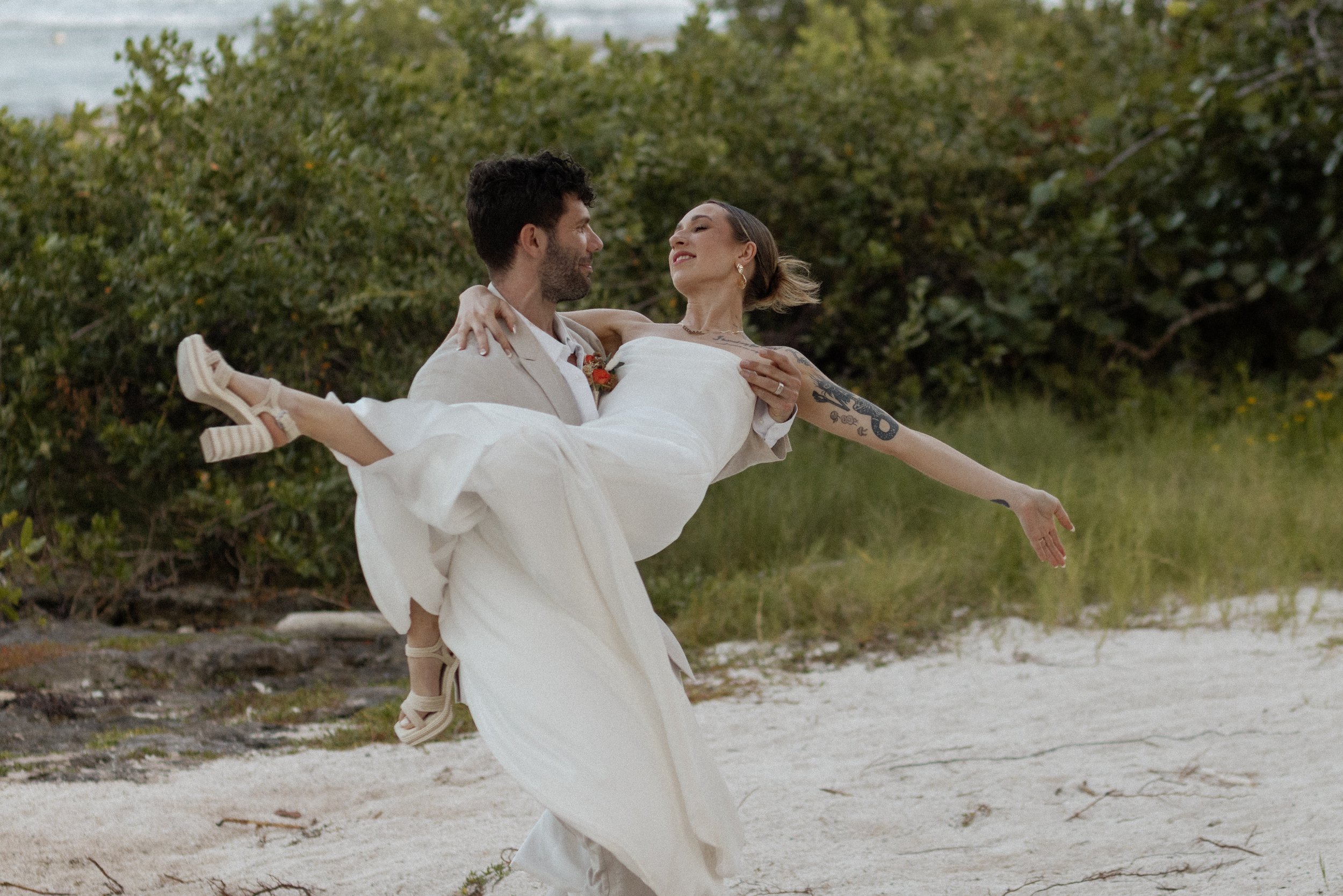 Swept away by love, bride and groom, to this joyful moment on the shores of Blue Venado Weddings is what destination wedding dreams are made of. Her radiant smile says it all! So happy to capture these genuine feelings.  #BlueVenadoWeddings #GroomCar