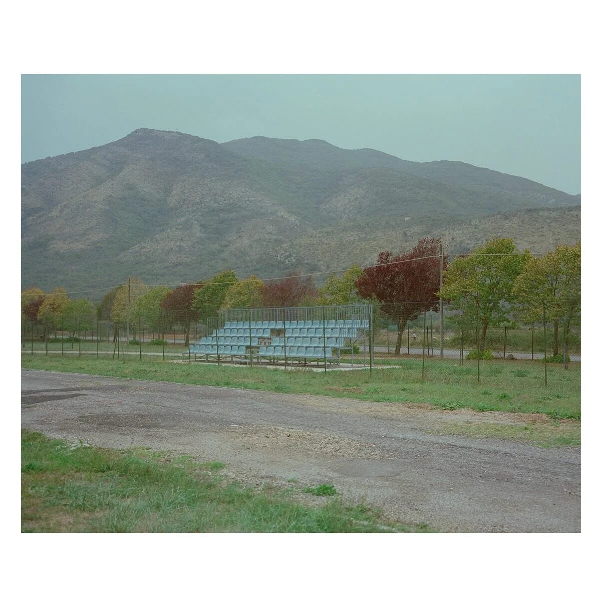 Two Joggers and a Shepherd. 
.
Centro Sportivo Comunale, Pastena, Italy
October 2023
.
Plaubel Makina 67
Kodak Portra 400
.
#pastena #calcio #football #terrace #mountains #centrosportivocomunale #sportivo #comunale #arena #local #italia #italy #lazio