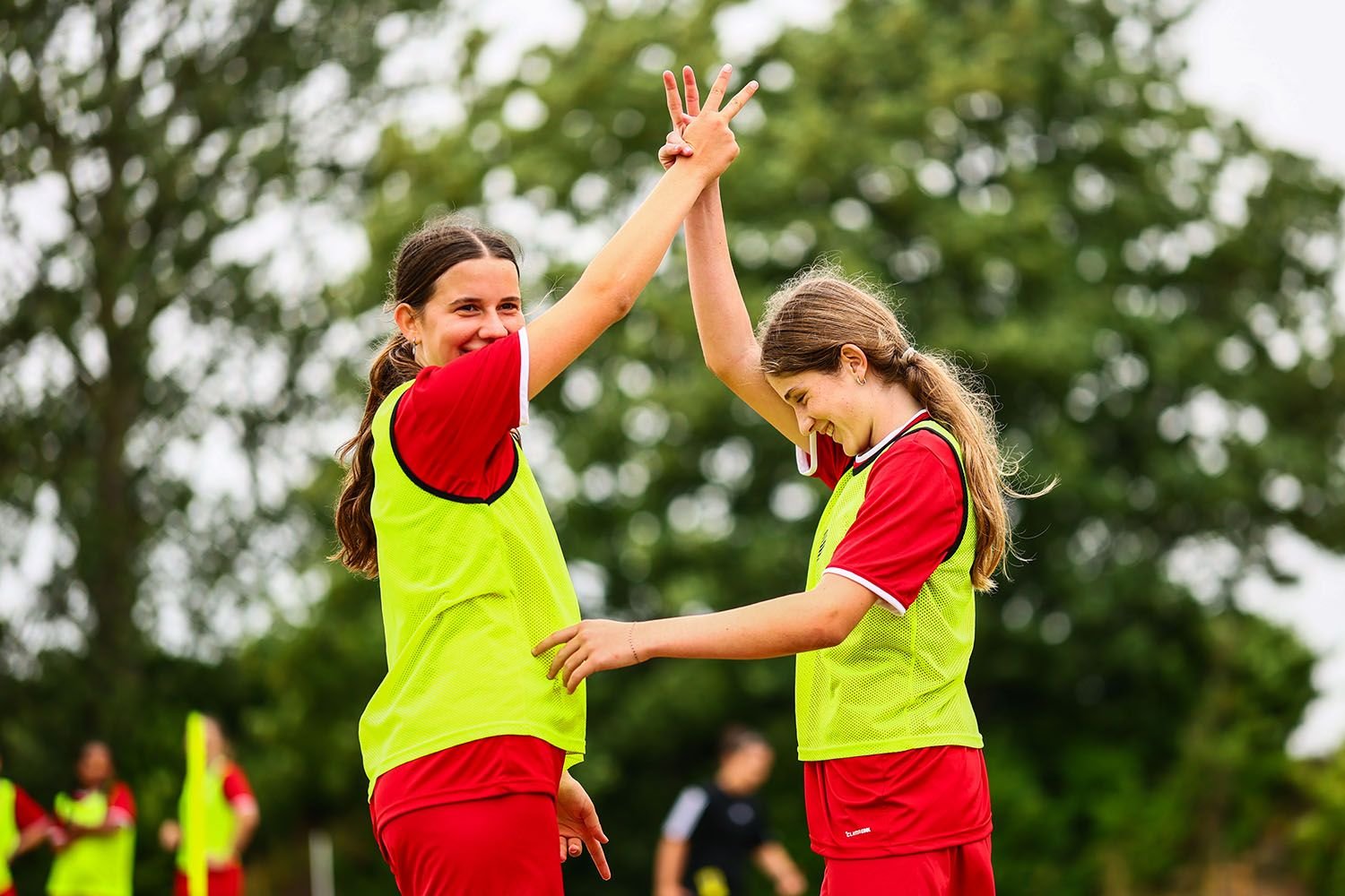 Two girls holding hands on camp