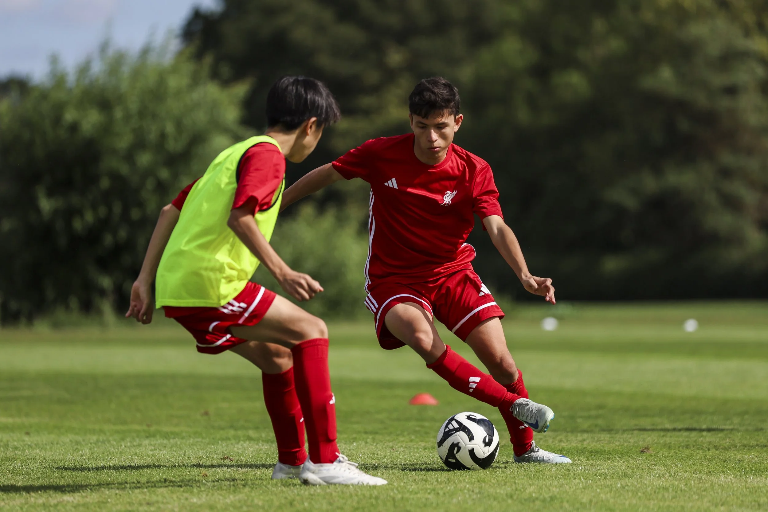 Players training on the pitch on LFC camp