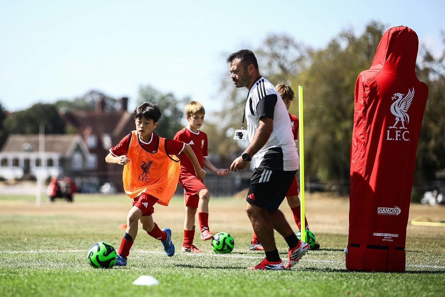 Player and LFC coach in training drill