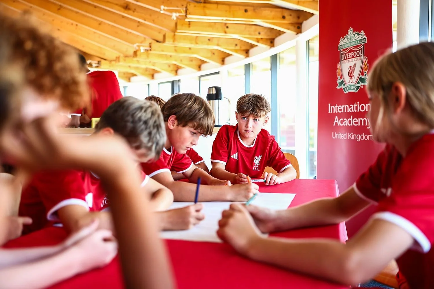 Boys on Liverpool camp in classroom session