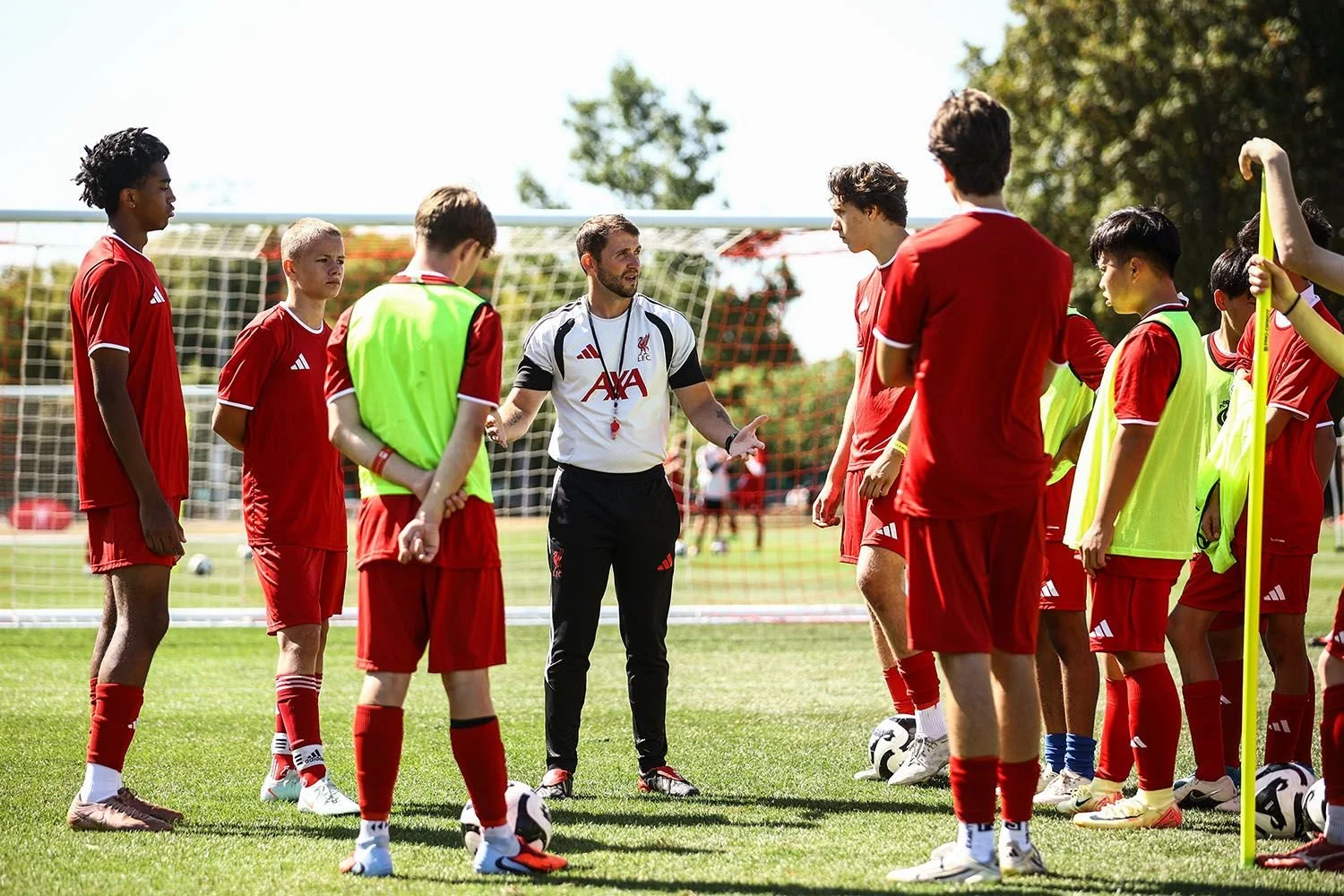 Coach talking to players on camp