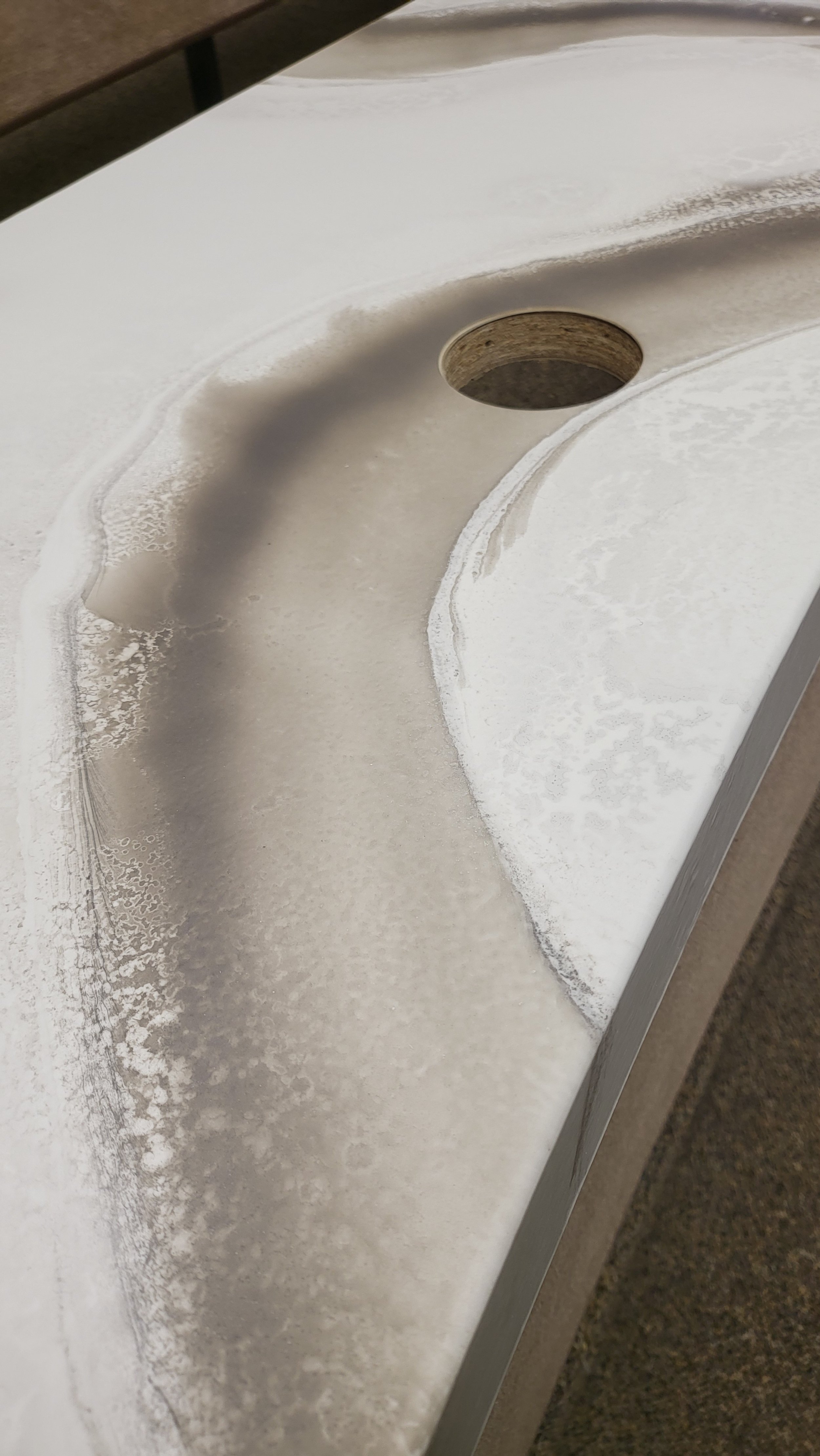 Close-up of a white epoxy marble countertop.