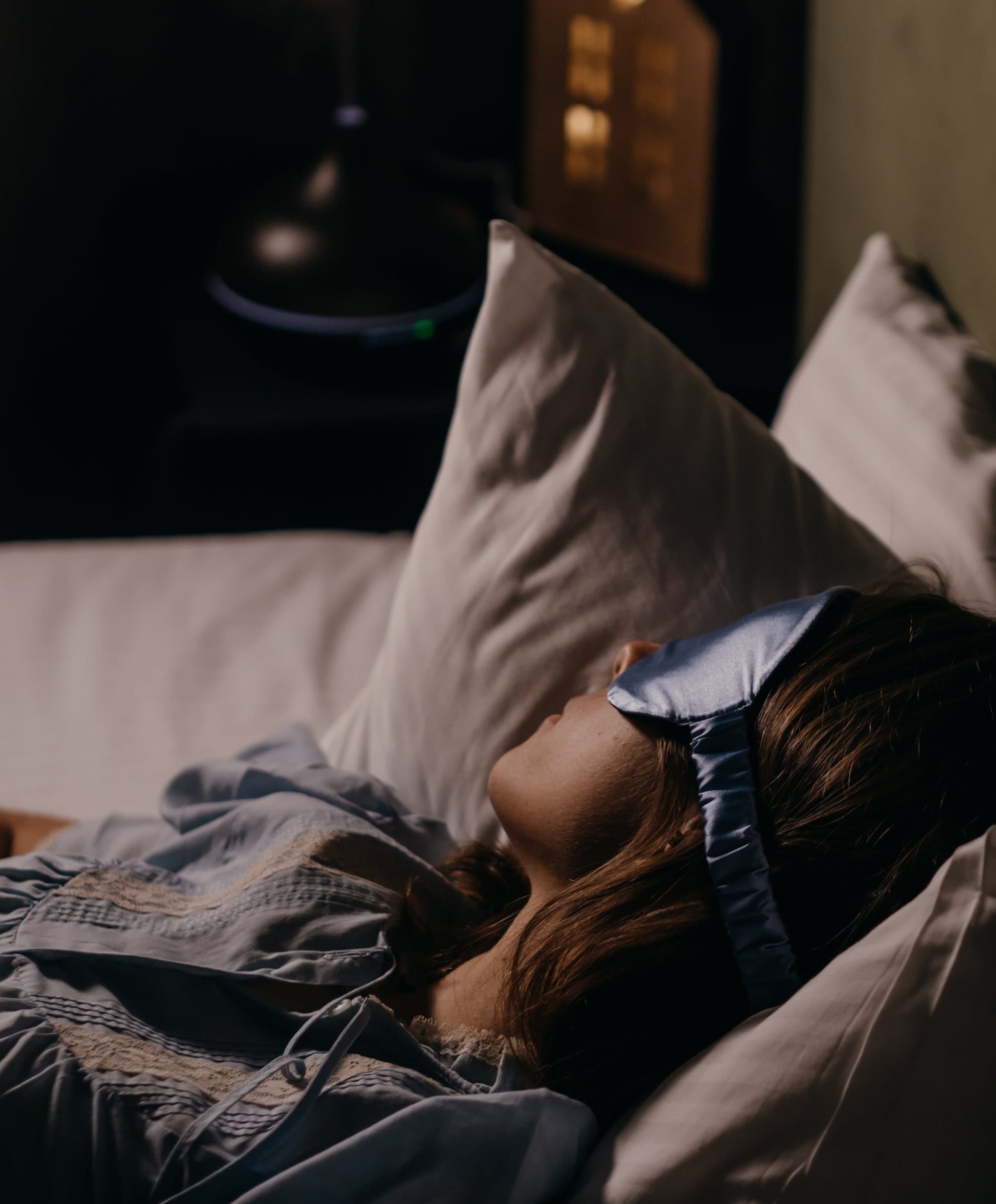 woman wearing an eye mask during a ketamine assisted therapy session