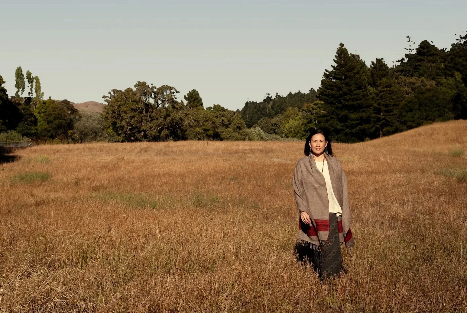 woman walking peacefully in a meadow