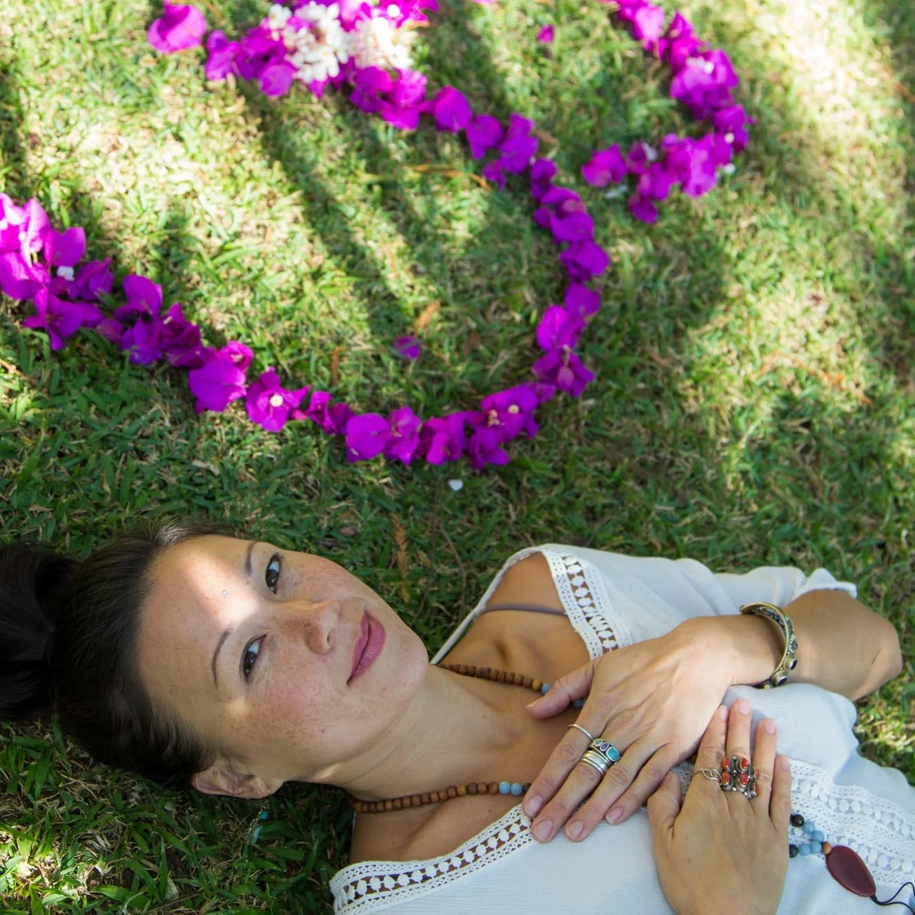 woman laying in the grass spiritual therapy