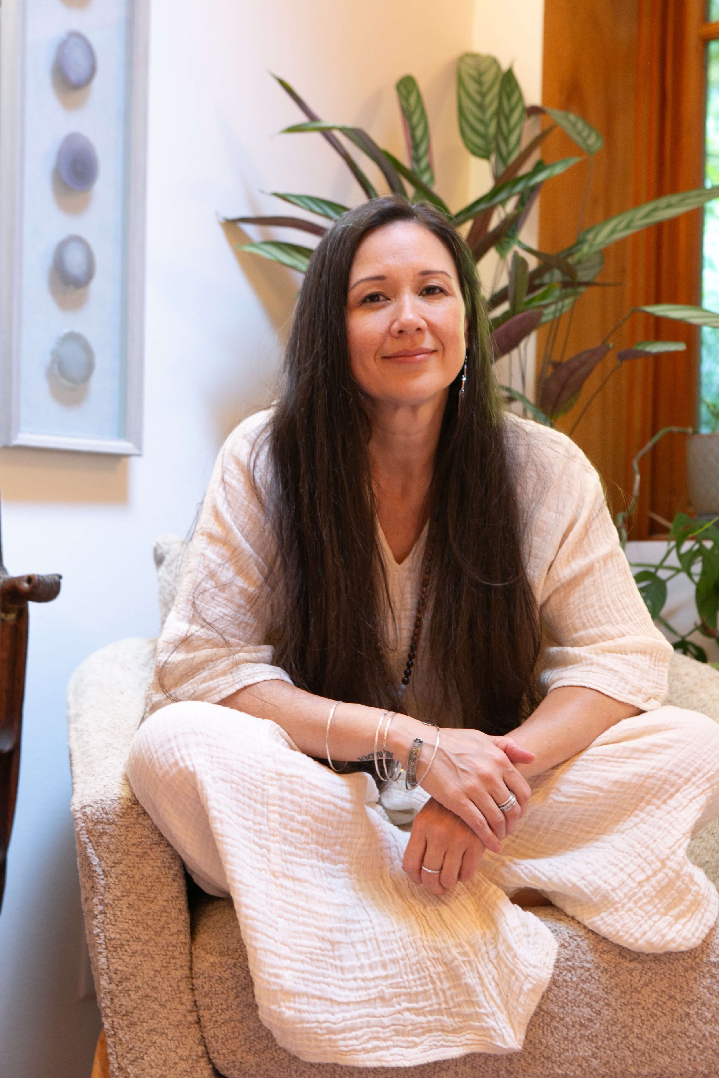 woman sitting in a chair in a therapy office