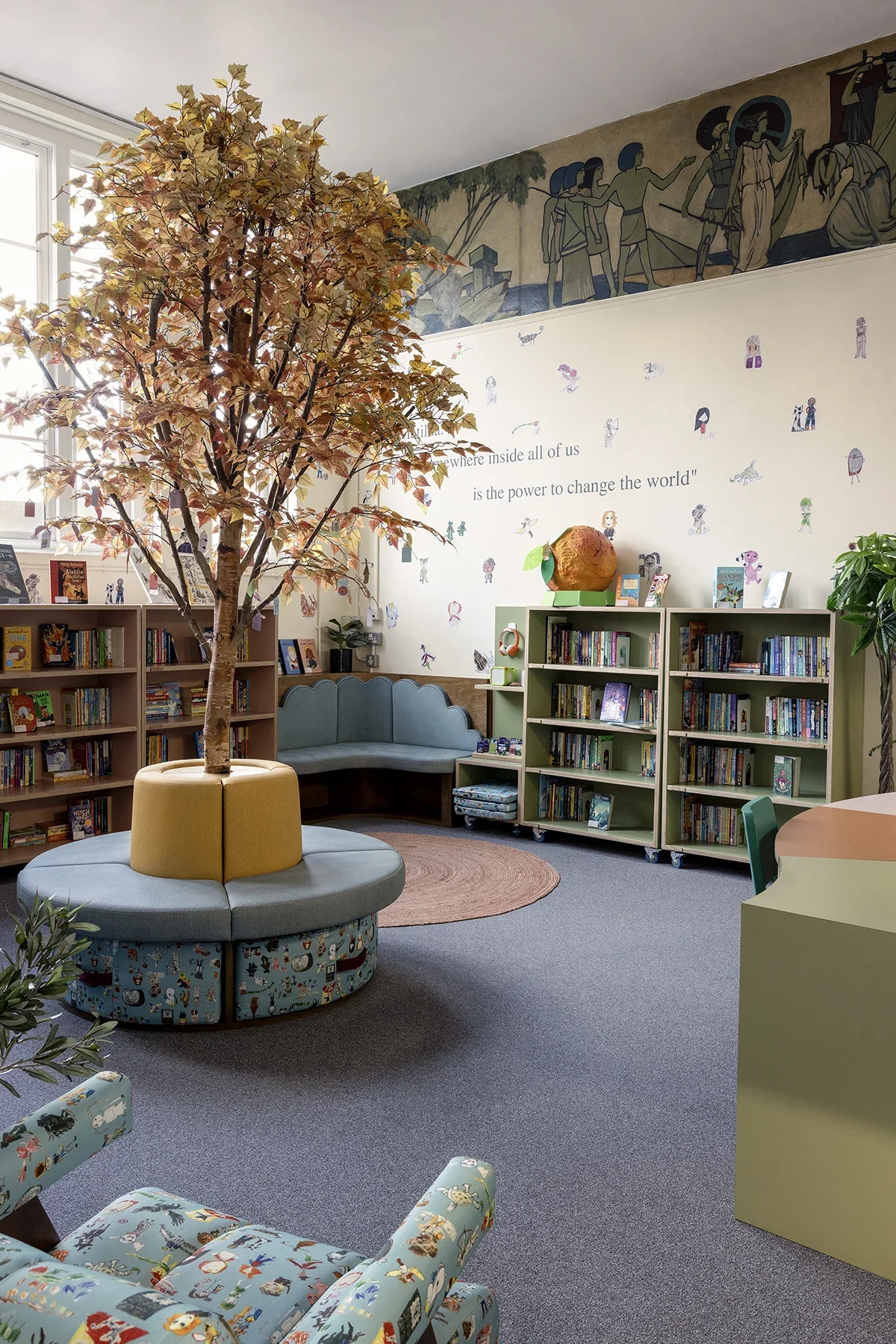 0000_5.-Upholstered-armchair-and-fixed-seating-school-library-planting-Kai-Interiors_West-Green-Primary.webp