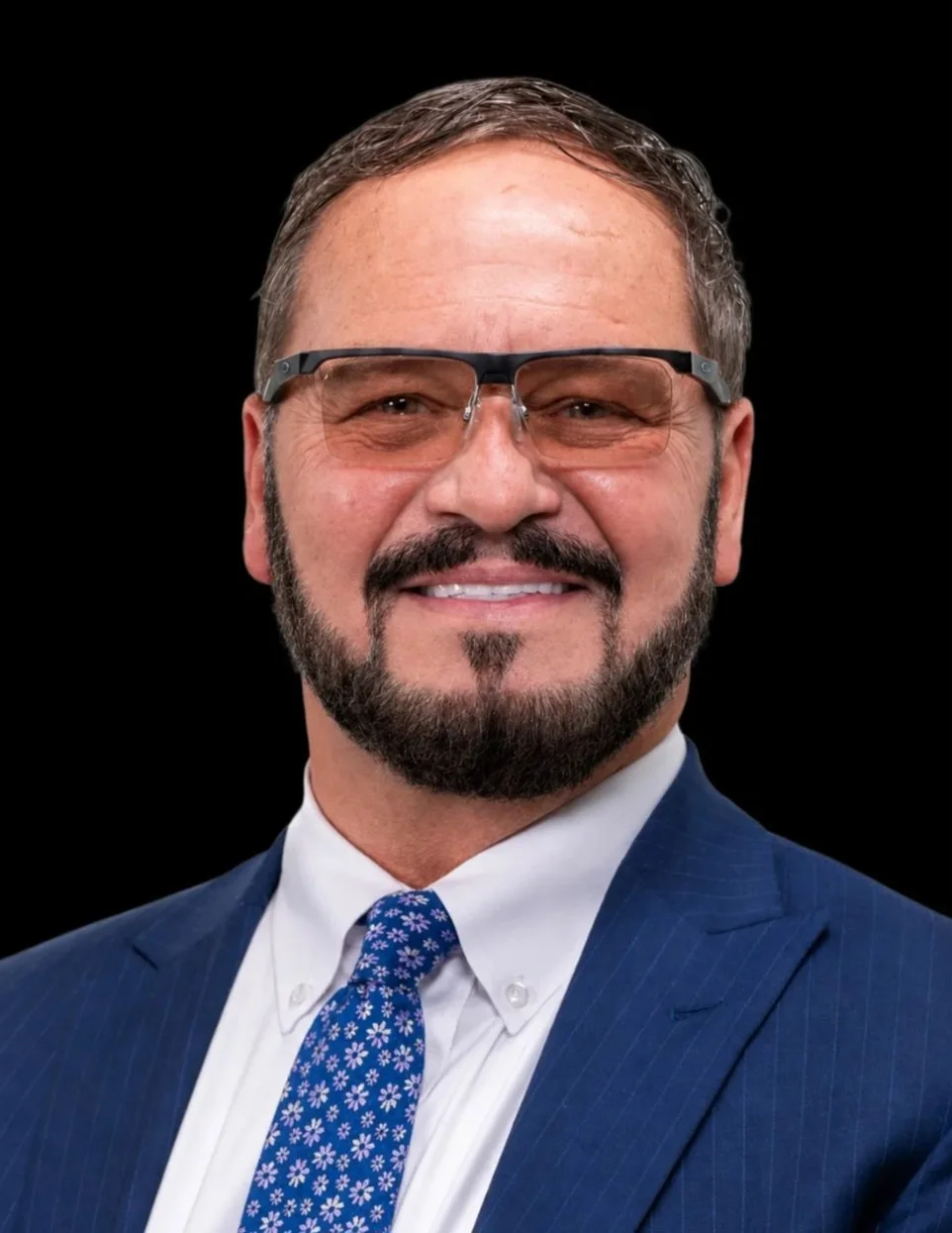 Man wearing glasses smiling to camera